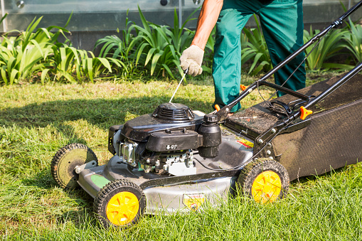 how to drain gas from lawn mower
